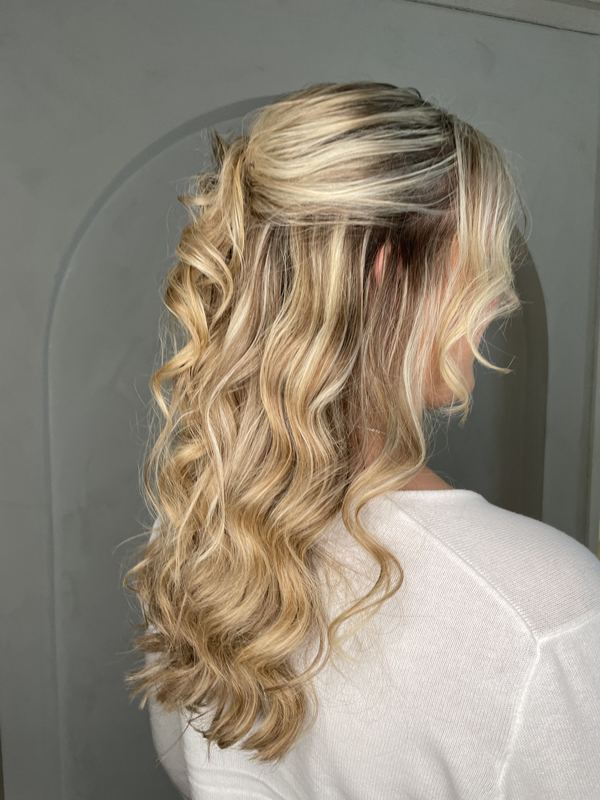 Soft blonde half up style with loose waves
