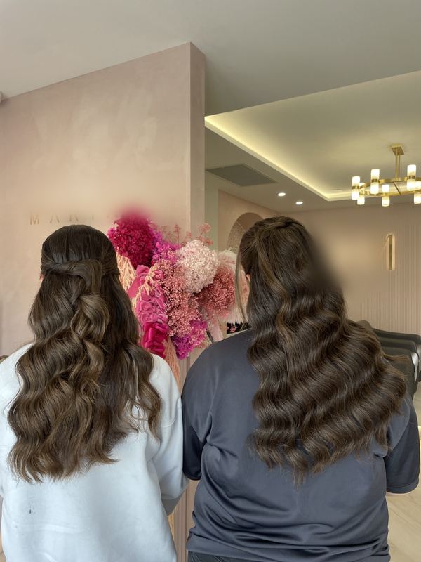 Two bridesmaids with matching half up waves
