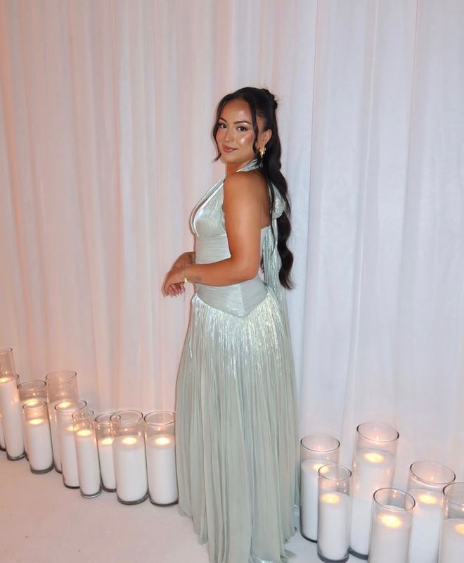Formal guest in a mint gown with a half up style